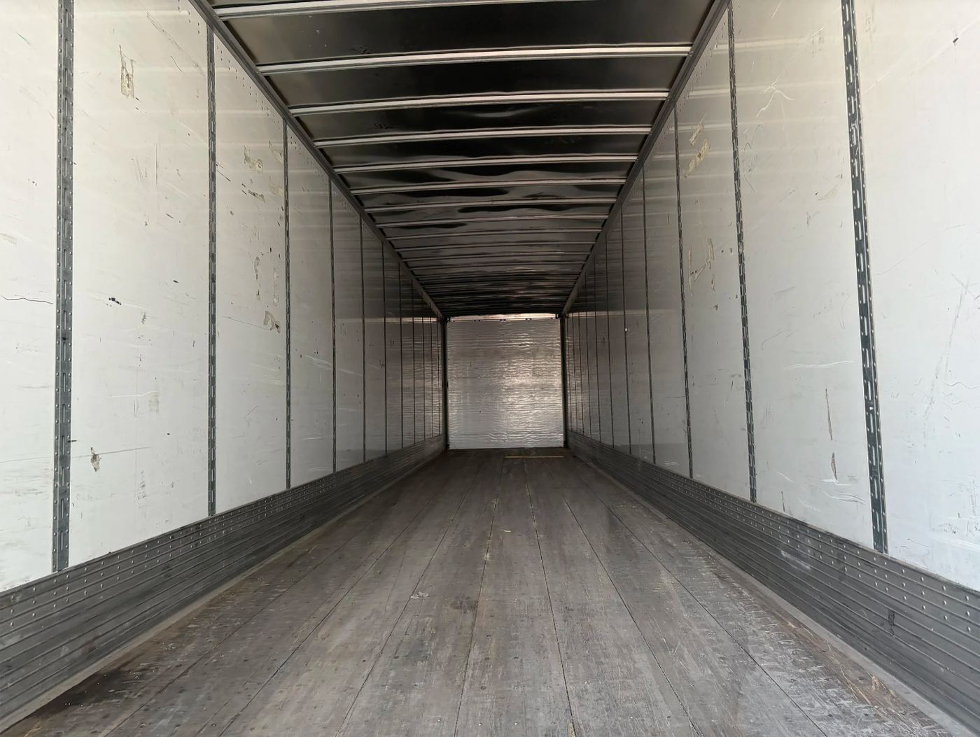 Empty interior of a NimbleBox 53' storage trailer, showing available floor space
